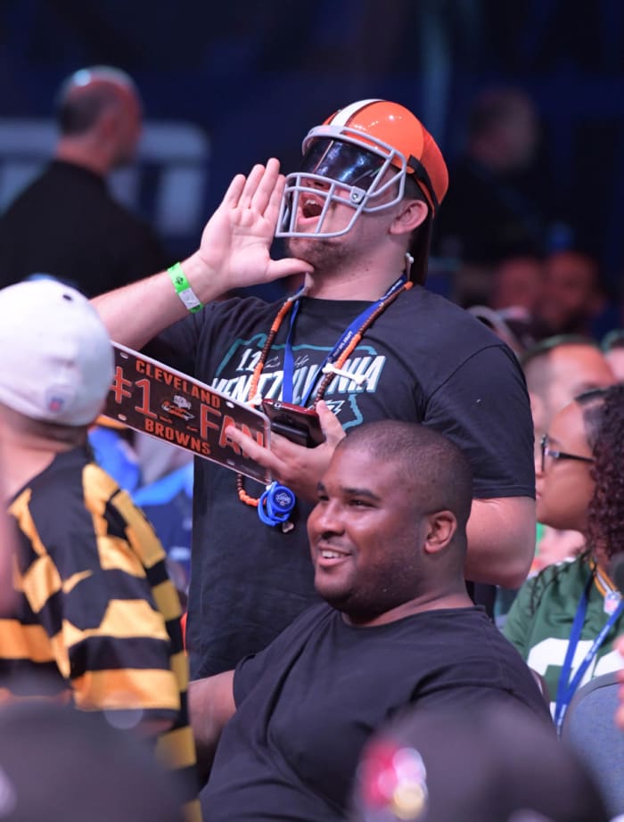 A Cleveland fan shouts after one of the team's draft picks was announced during the 2017 NFL Draft in Philadelphia. The team's '17 draft class was solid, but the Browns do have an unfortunate history of poor drafts.